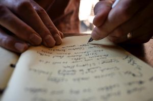 Writing in a Notebook at The Roaster by Nozy Coffee Jingumae Tokyo Japan