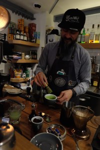 Barista Making a Matcha Latte at Deus ex Machina Harajuku Cafe Tokyo Japan