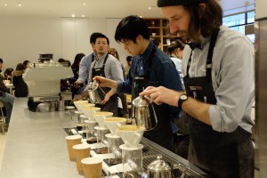 Baristas making pour over coffee at Blue Bottle Coffee Shinjuku Tokyo Japan