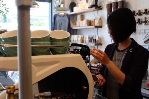 Female Barista at Espresso Machine at Unlimited Coffee Bar in Narihira Tokyo Japan