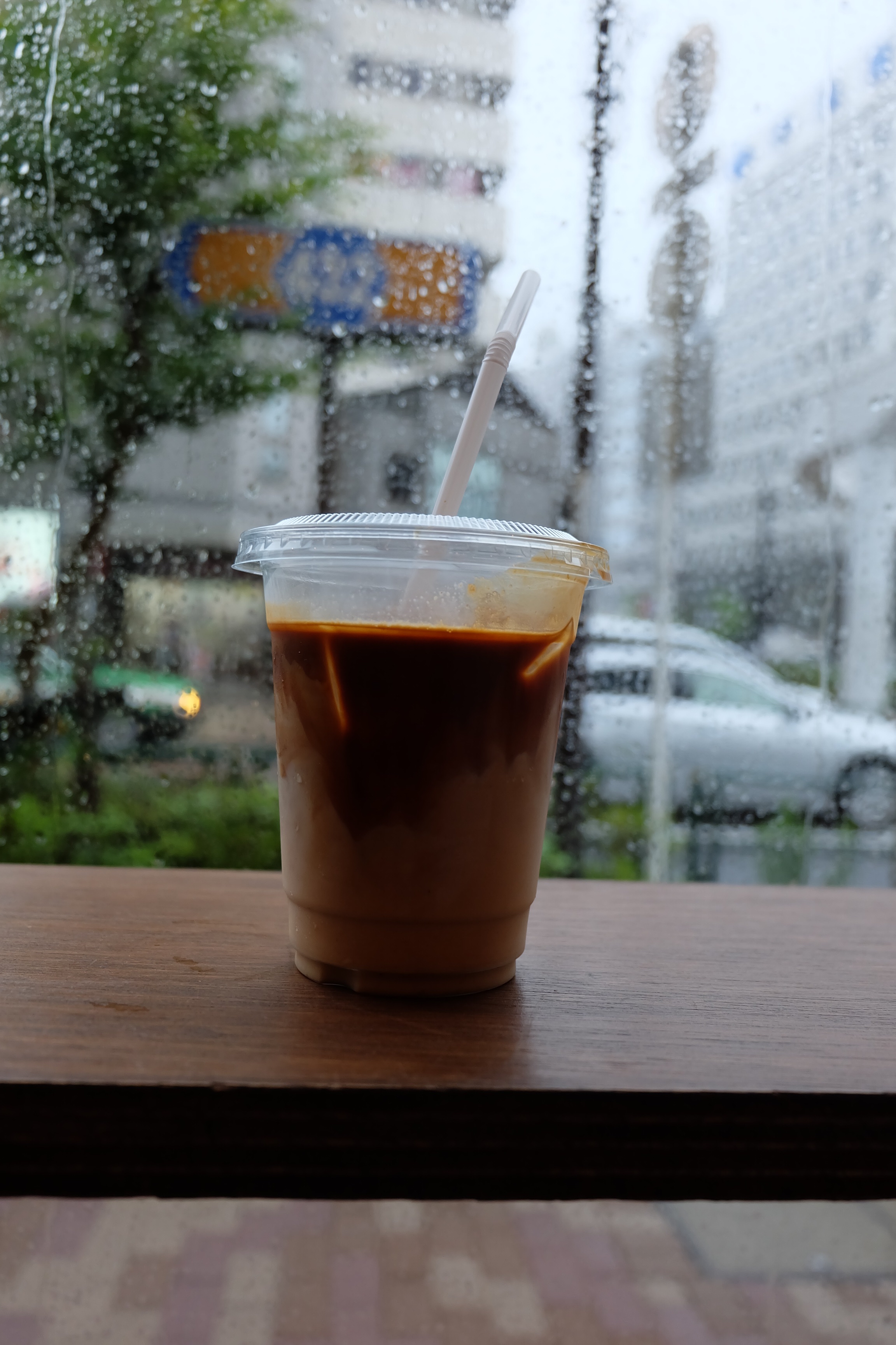 Iced Coffee by Rainy Window at Counterpart Coffee Gallery Nishi Shinjuku Tokyo Japan