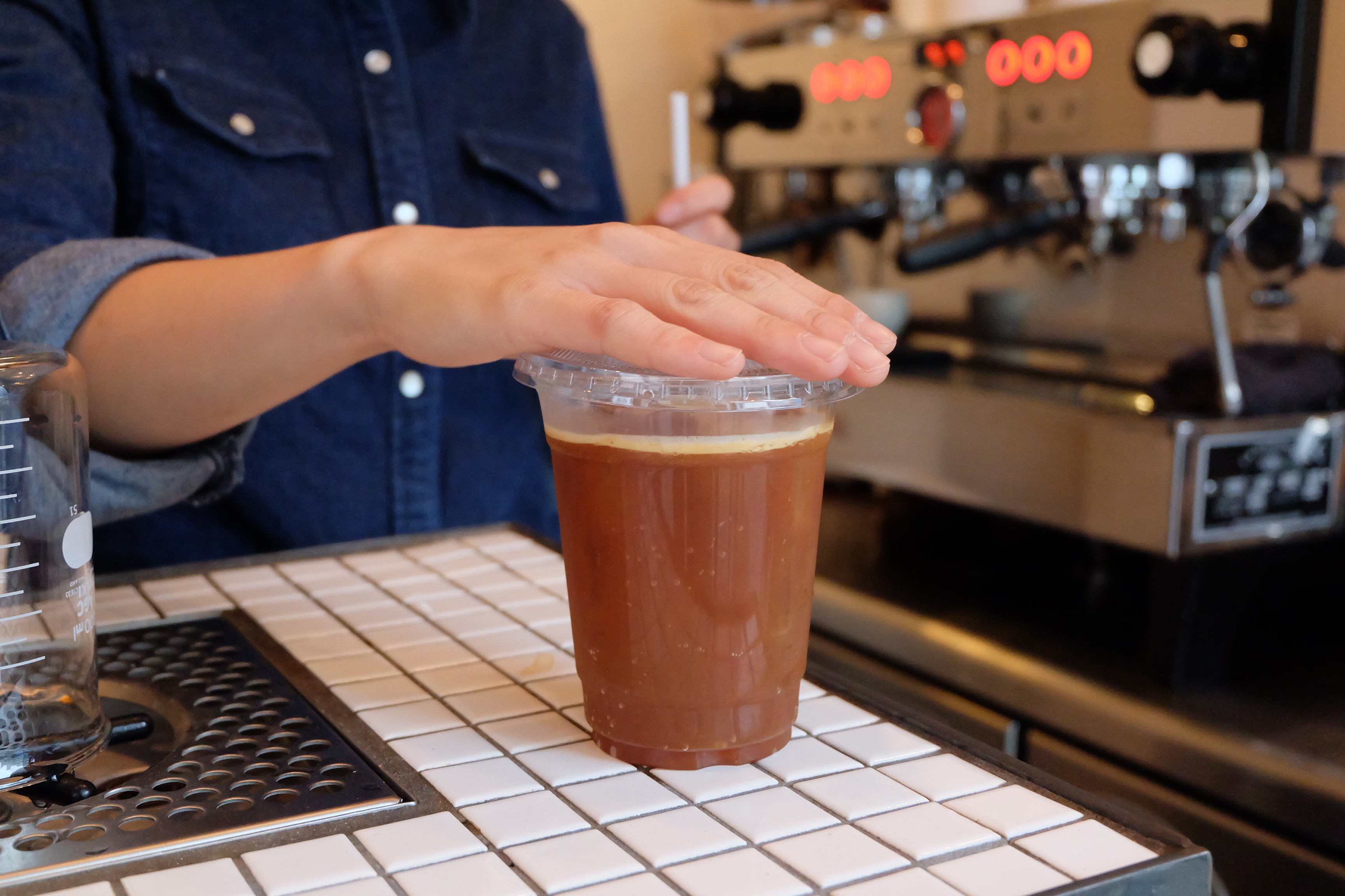 Careful Barista Hands at Counterpart Coffee Gallery Nishi Shinjuku Tokyo Japan