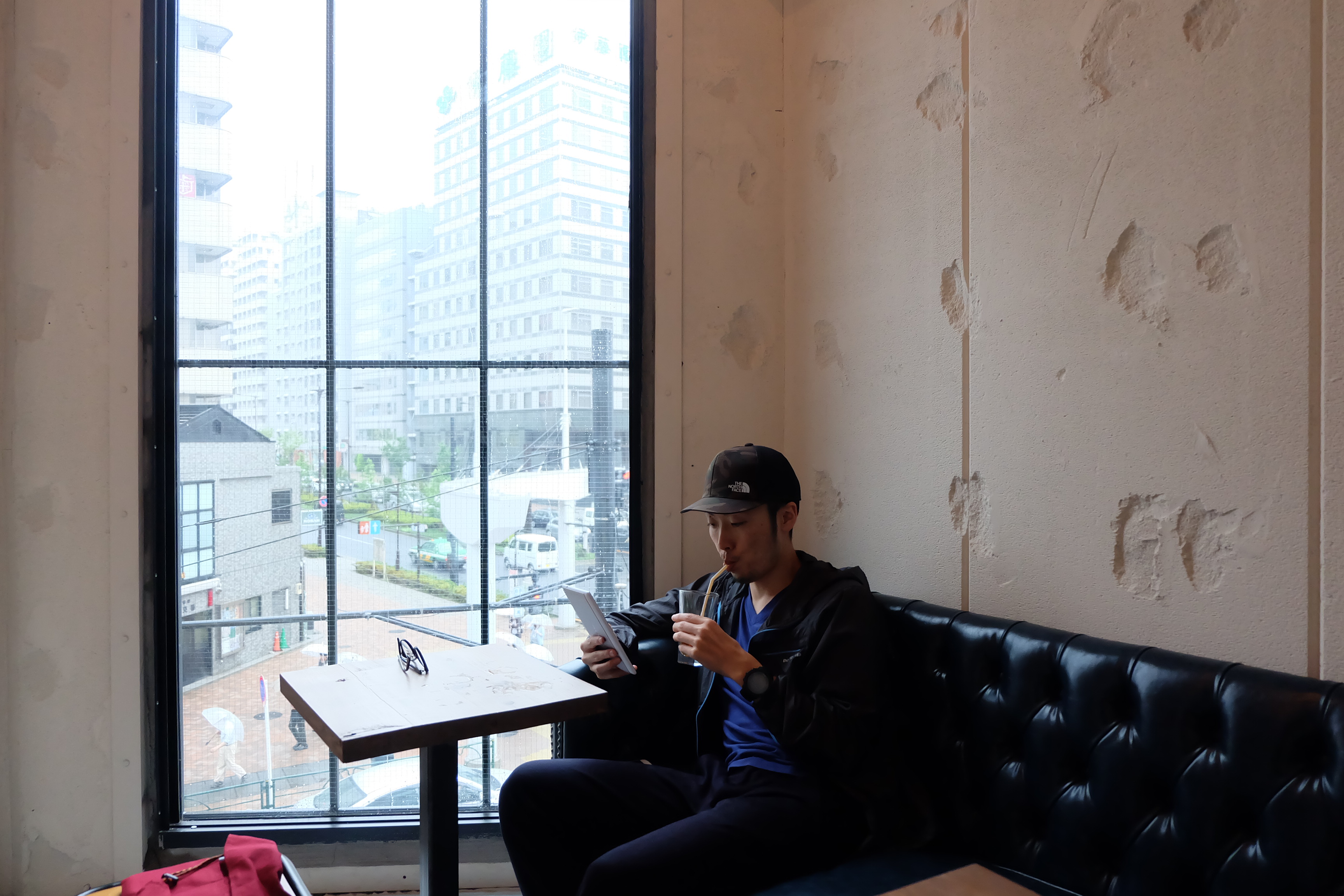 Customer on a Sofa at Counterpart Coffee Gallery Nishi Shinjuku Tokyo Japan