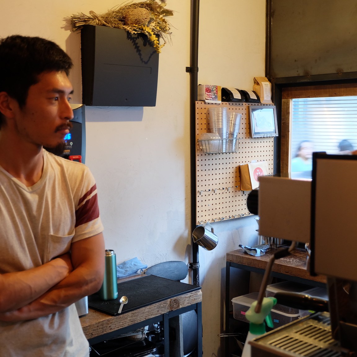 Barista with arms crossed at Iron Coffee at Gotokuji Tokyo Japan